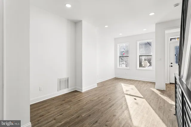 a view of livingroom with hardwood floor and hallway