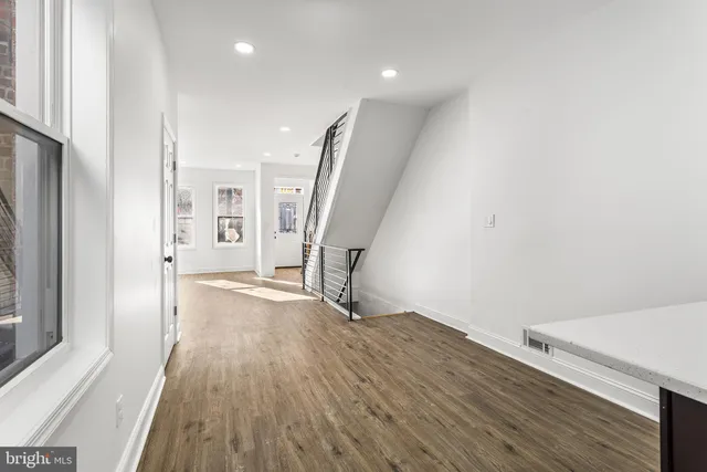 a view of entryway with wooden floor