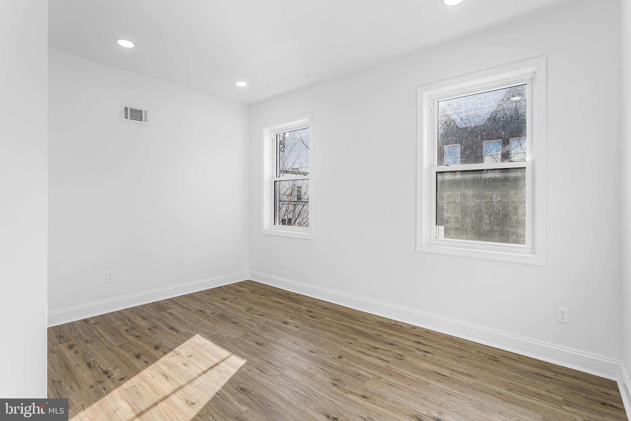 2933 Master Street Philadelphia, PA 19121 - Photo 18 of 28 a view of a big room with wooden floor and a window