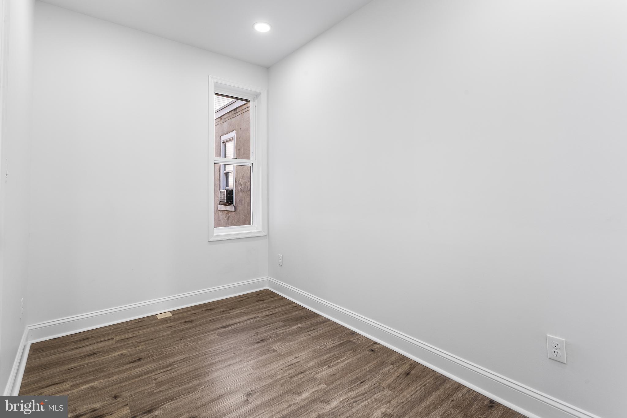 2933 Master Street Philadelphia, PA 19121 - Photo 22 of 28 a view of a hallway with wooden floor and closet