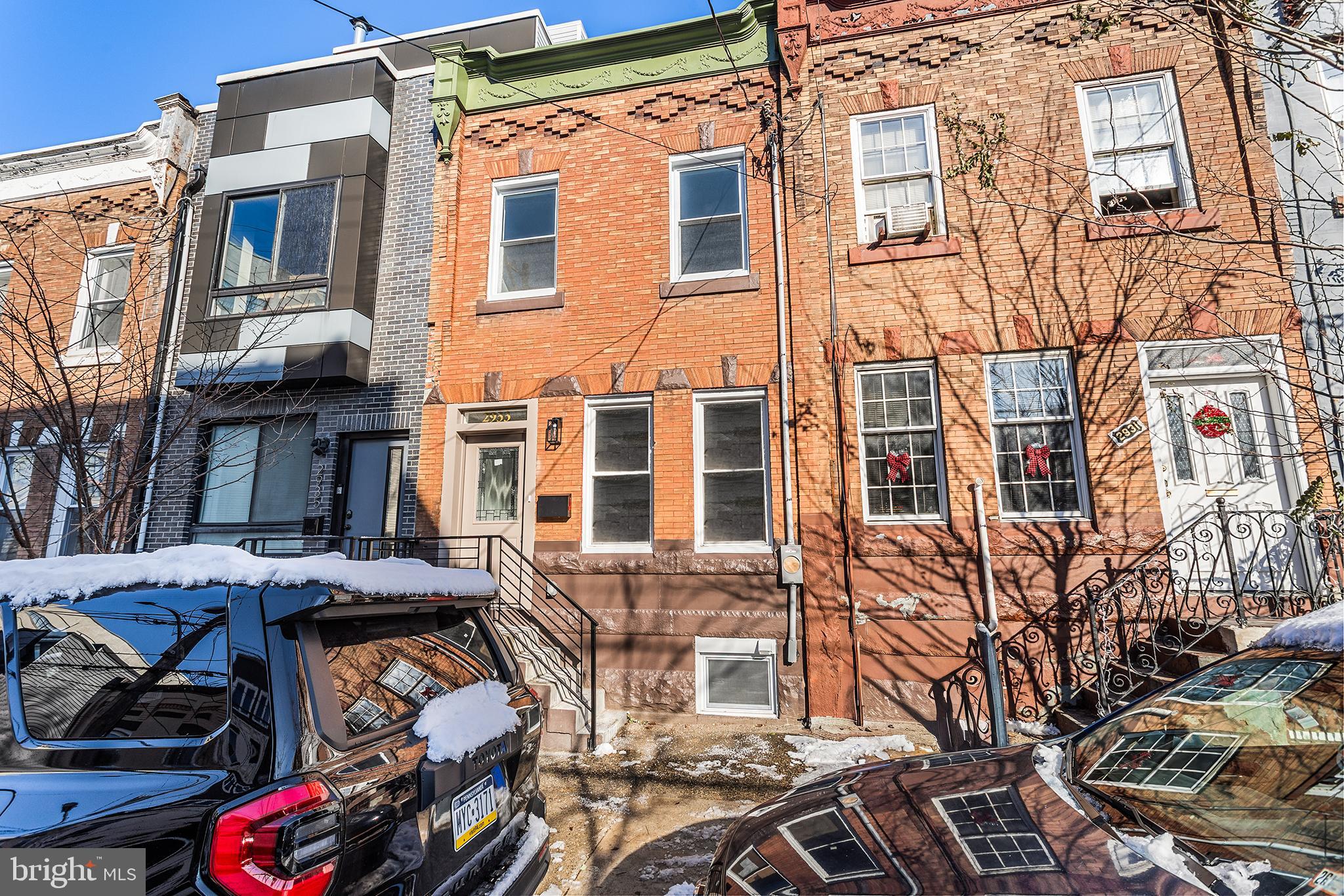 2933 Master Street Philadelphia, PA 19121 - Photo 27 of 28 a view of a blue building with many windows