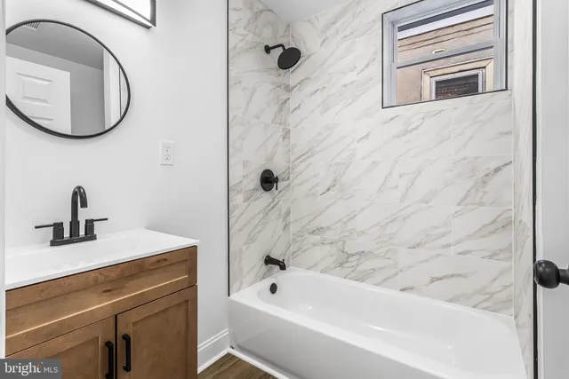 a bathroom with a sink a vanity and a mirror