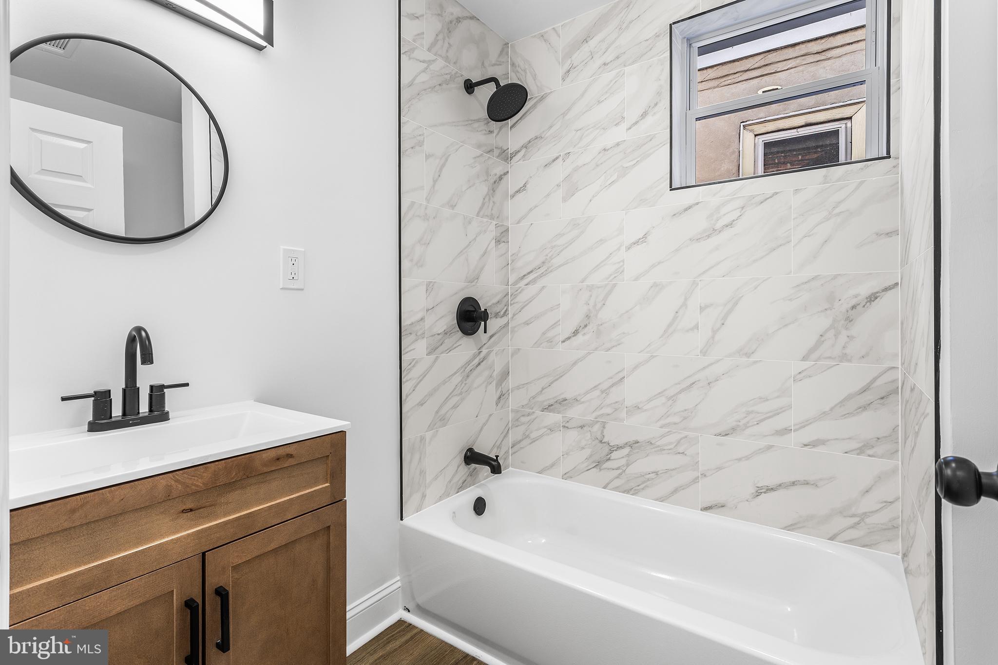 2933 Master Street Philadelphia, PA 19121 - Photo 9 of 28 a bathroom with a sink a vanity and a mirror