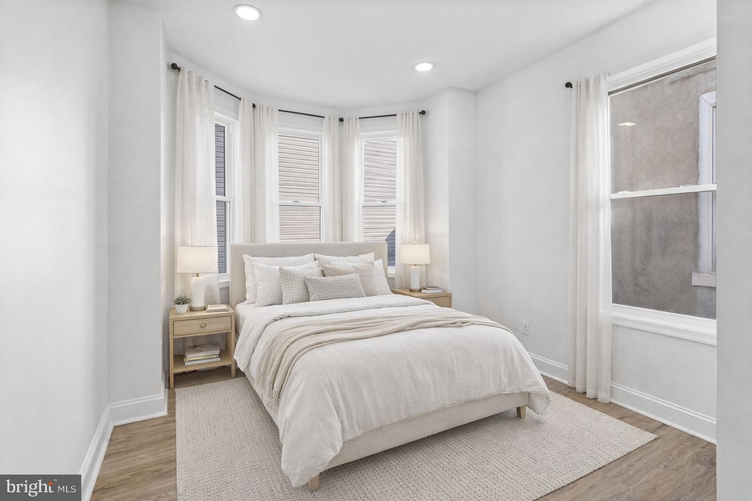 2933 Master Street Philadelphia, PA 19121 - Photo 10 of 28 a bedroom with a large bed and a large window