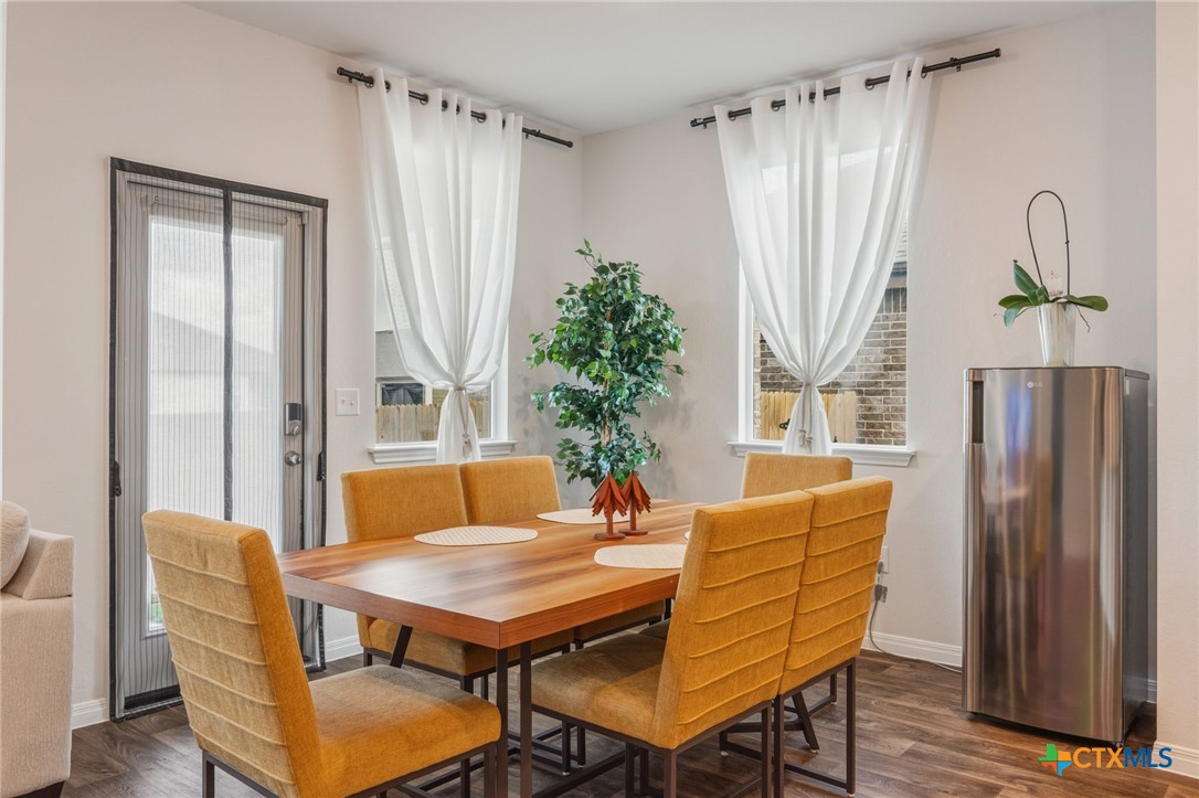 205 Charles Trail Georgetown, TX 78626 - Photo 1 of 38 a dining room with furniture and window