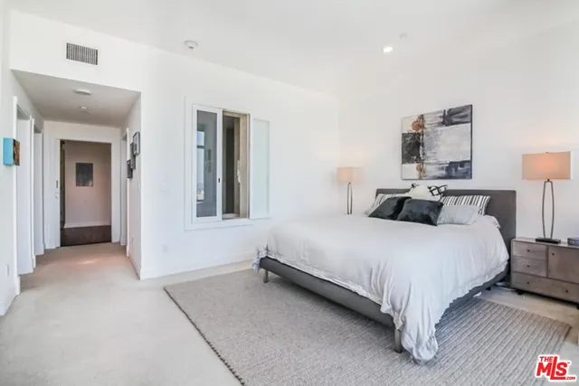 a bedroom with a bed and closet