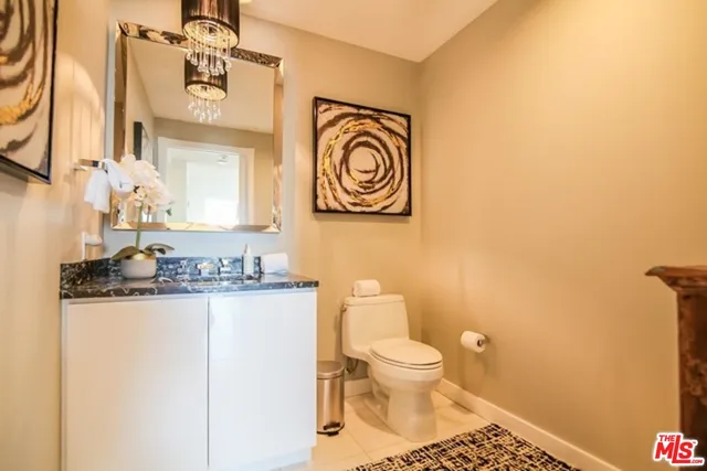 a bathroom with a sink a toilet and vanity