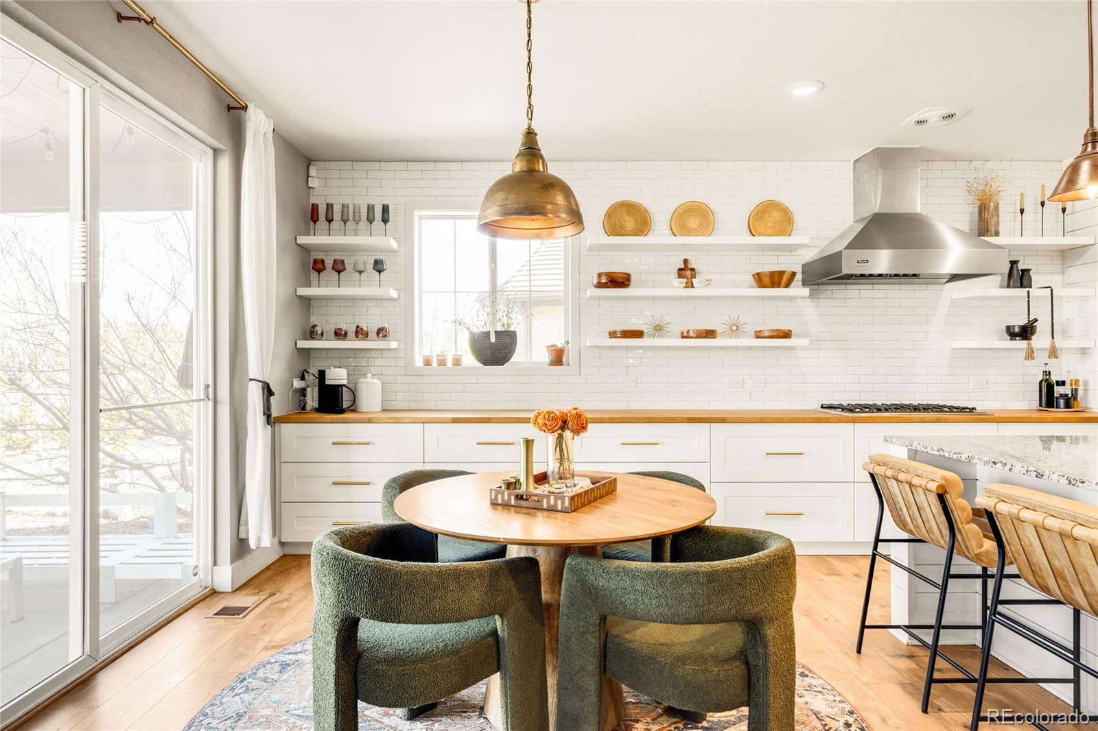 683 Tiger Lily Way Highlands Ranch, CO 80126 - Photo 12 of 50 a kitchen with stainless steel appliances granite countertop a sink and a stove