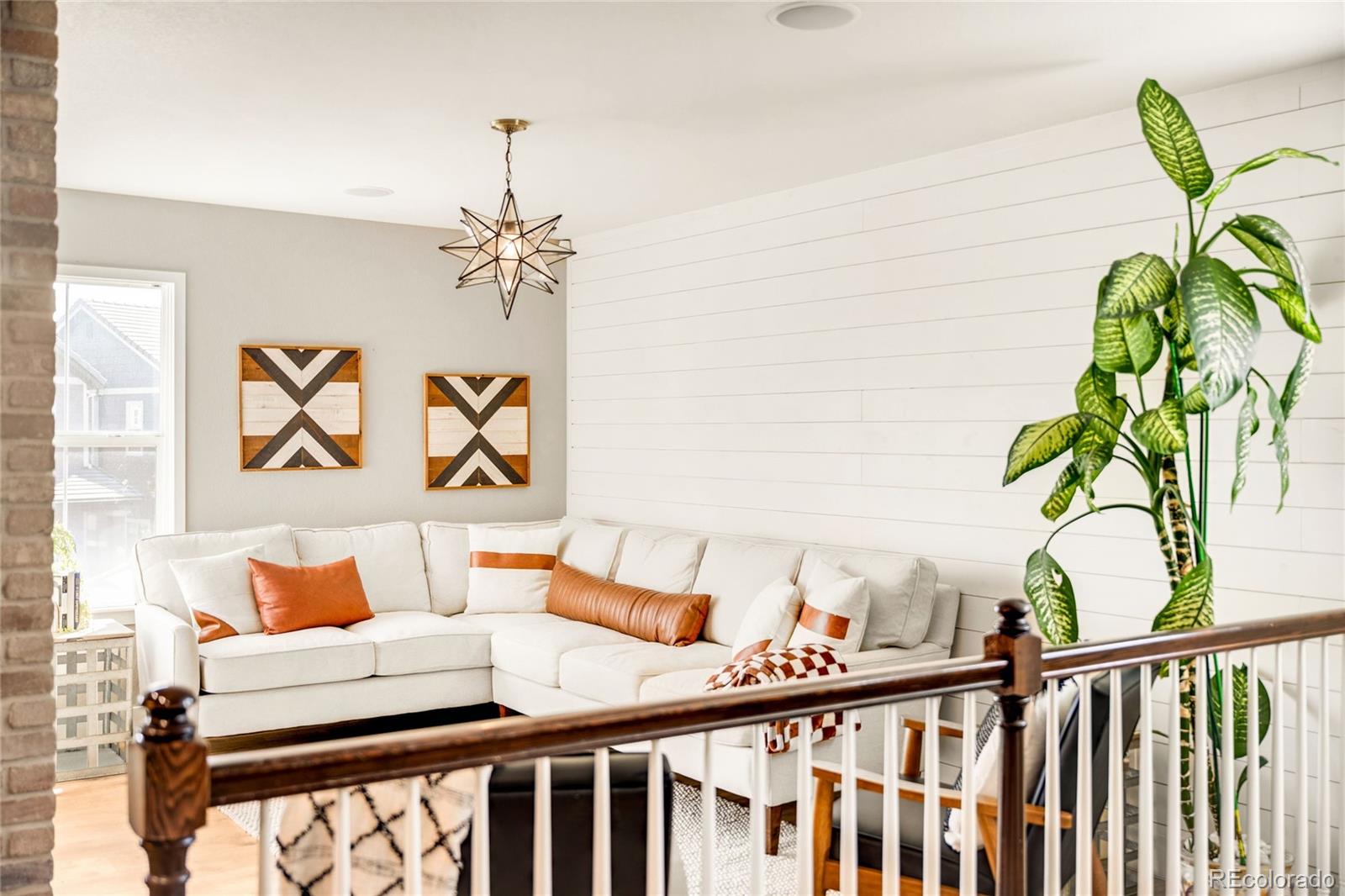 683 Tiger Lily Way Highlands Ranch, CO 80126 - Photo 20 of 50 a bedroom with a bed and a chandelier