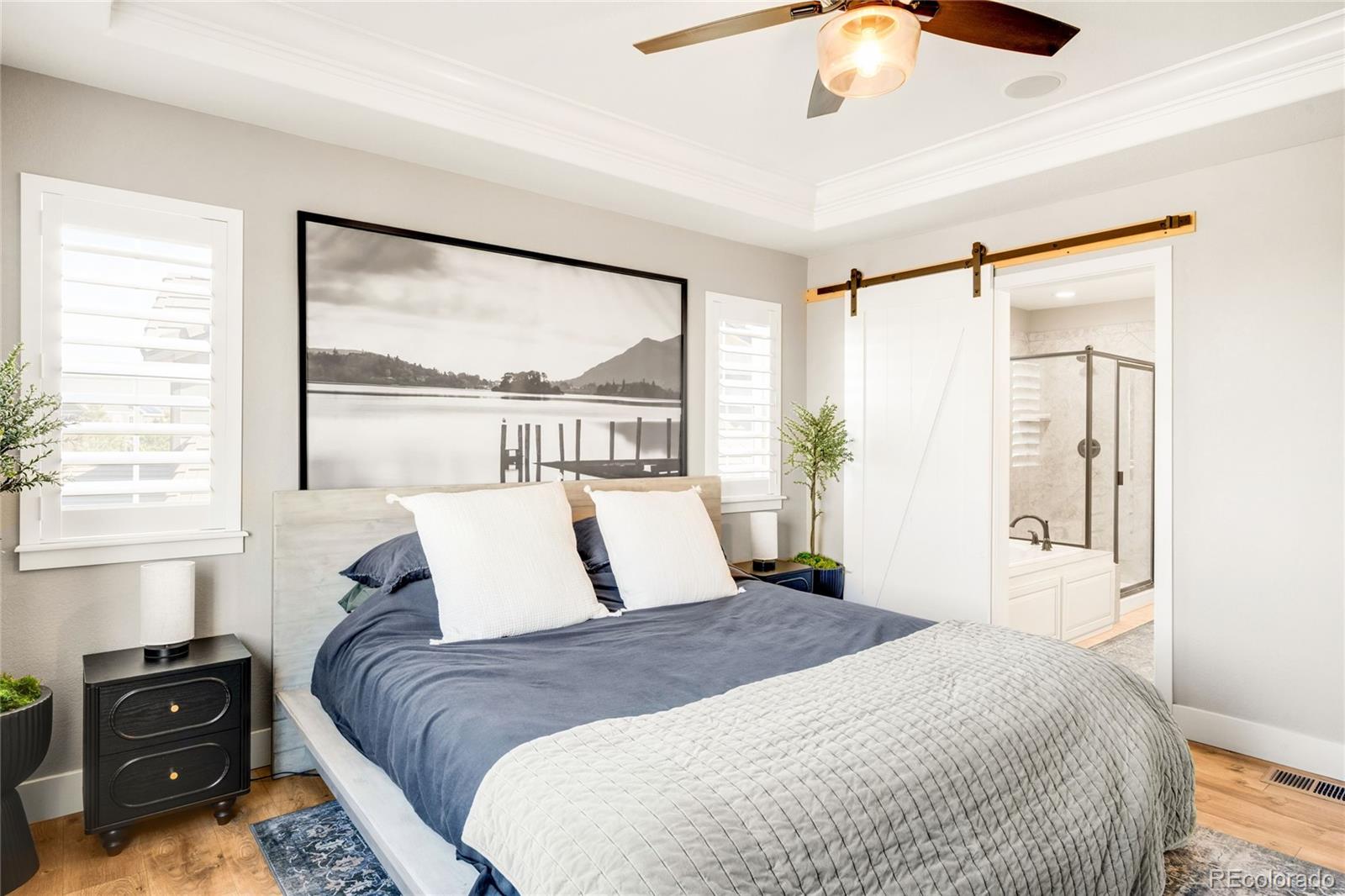 683 Tiger Lily Way Highlands Ranch, CO 80126 - Photo 25 of 50 a bedroom with a large bed and a window