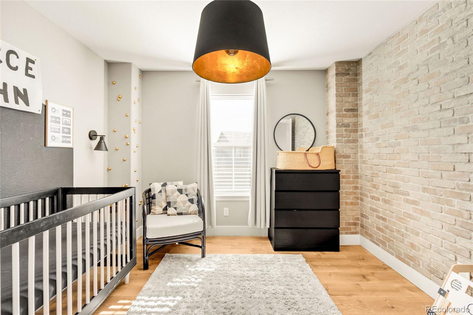 683 Tiger Lily Way Highlands Ranch, CO 80126 - Photo 30 of 50 a bedroom with a bed and a painting on the wall