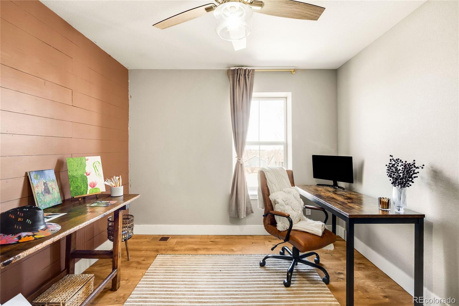 683 Tiger Lily Way Highlands Ranch, CO 80126 - Photo 31 of 50 a view of a workspace with furniture and a window