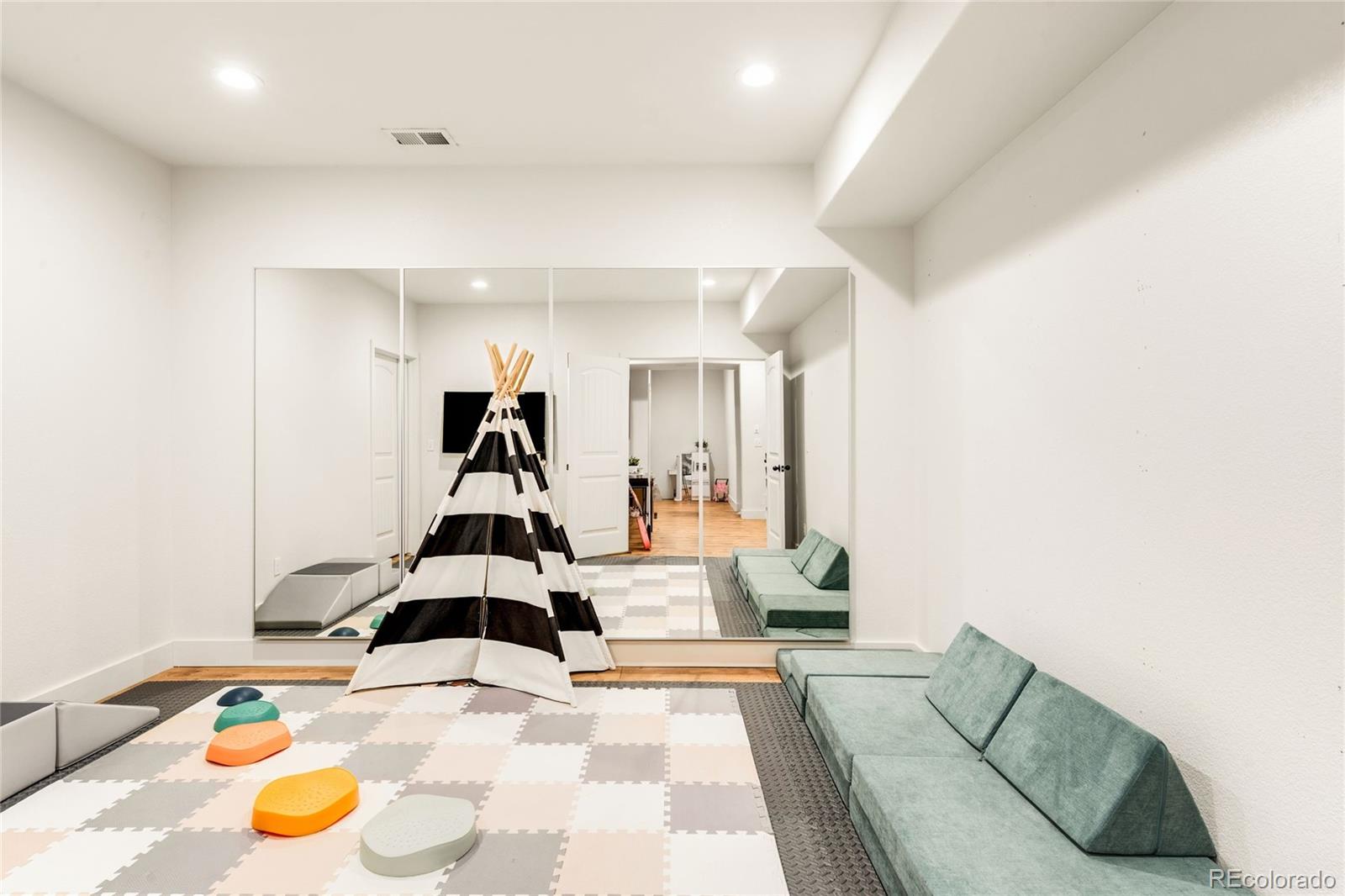 683 Tiger Lily Way Highlands Ranch, CO 80126 - Photo 36 of 50 a view of a room with gym equipment