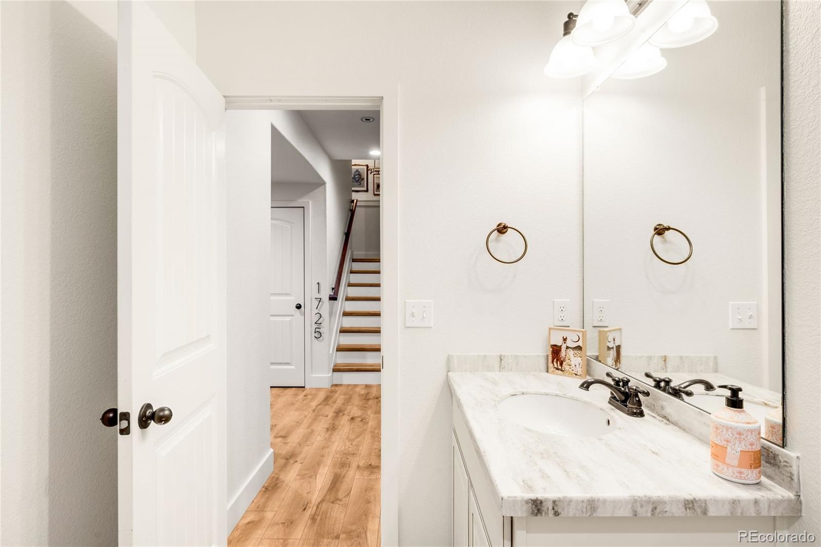 683 Tiger Lily Way Highlands Ranch, CO 80126 - Photo 38 of 50 a bathroom with a sink double vanity and a mirror