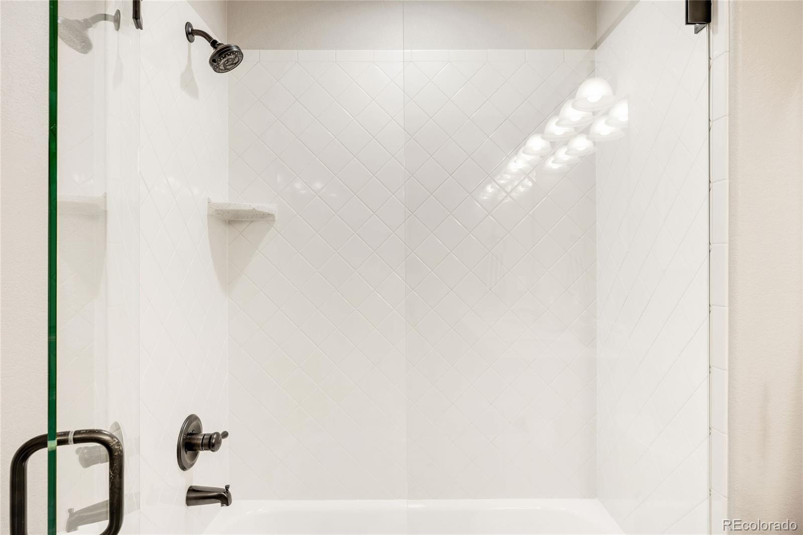 683 Tiger Lily Way Highlands Ranch, CO 80126 - Photo 39 of 50 a bathroom with a shower curtain