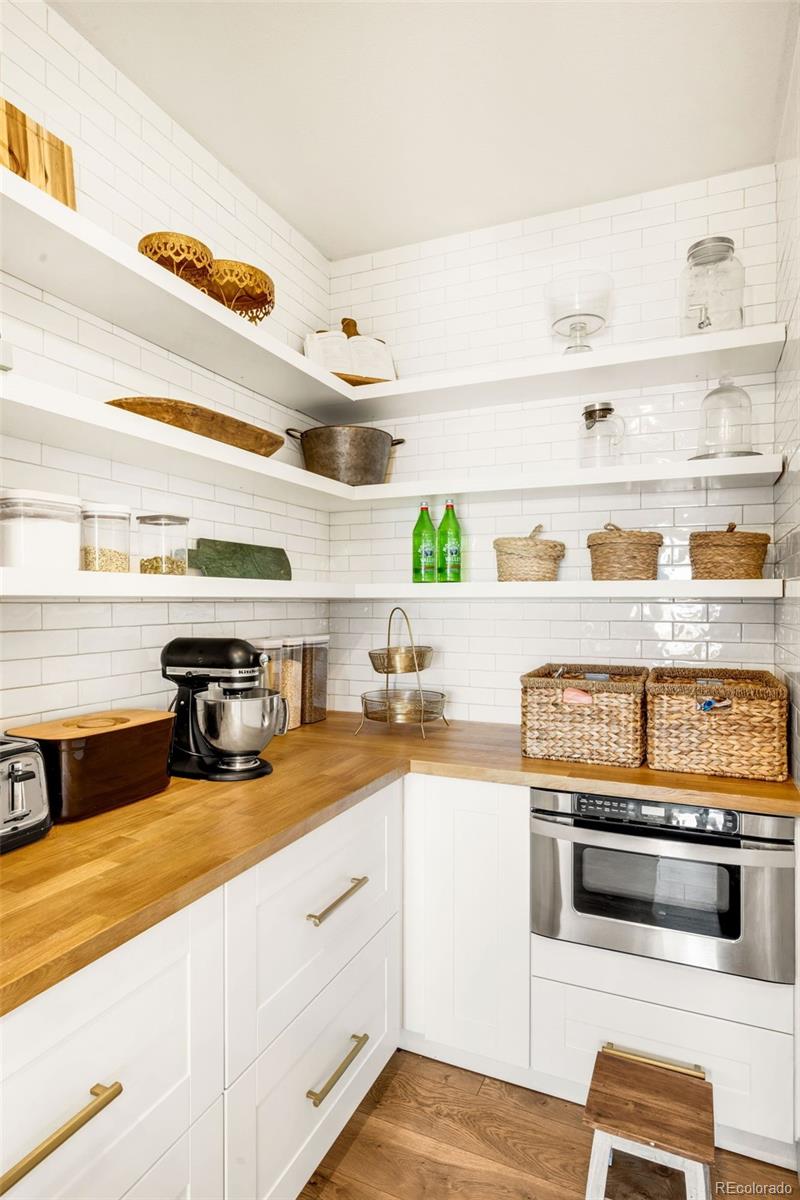 683 Tiger Lily Way Highlands Ranch, CO 80126 - Photo 9 of 50 a kitchen with cabinets and window
