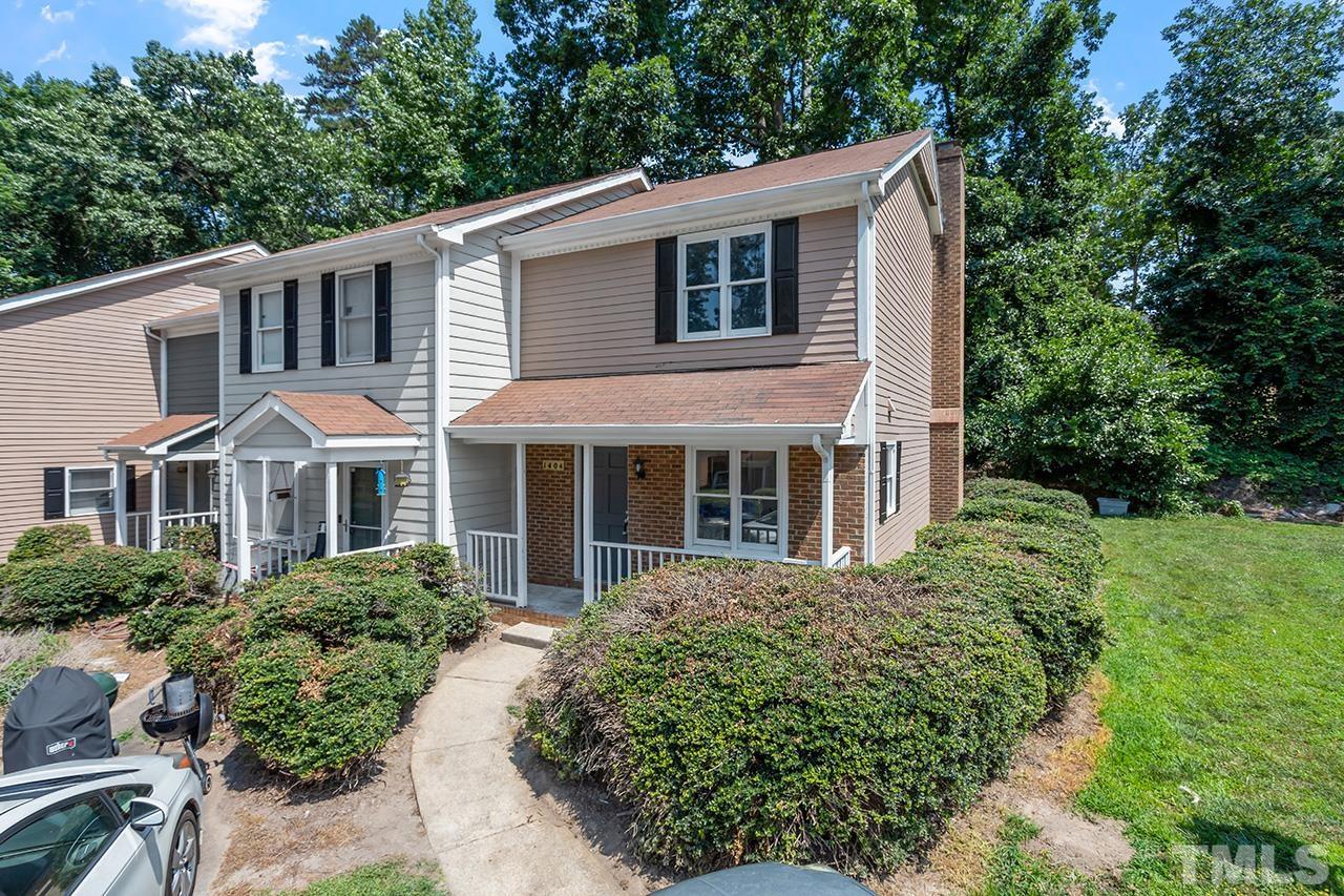 1404 Kent Road Raleigh, NC 27606 - Photo 1 of 28 a front view of a house with a yard