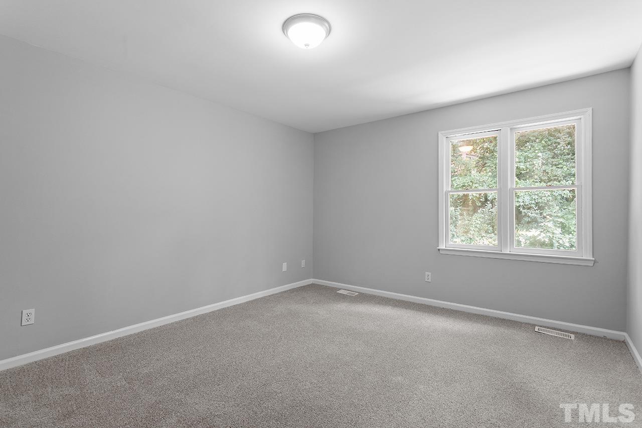 1404 Kent Road Raleigh, NC 27606 - Photo 19 of 28 an empty room with a window
