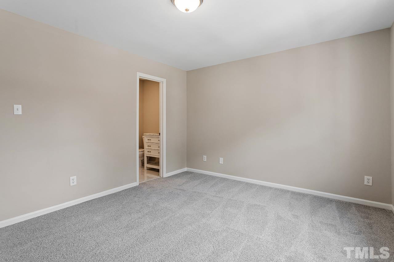 1404 Kent Road Raleigh, NC 27606 - Photo 22 of 28 a view of an empty room with closet and a window