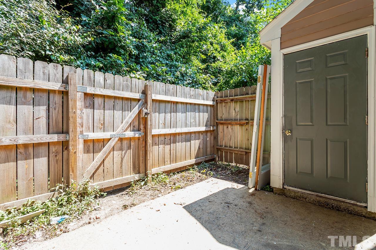 1404 Kent Road Raleigh, NC 27606 - Photo 27 of 28 a view of a house with a wooden fence