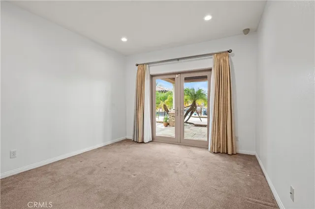 an empty room with yard and balcony