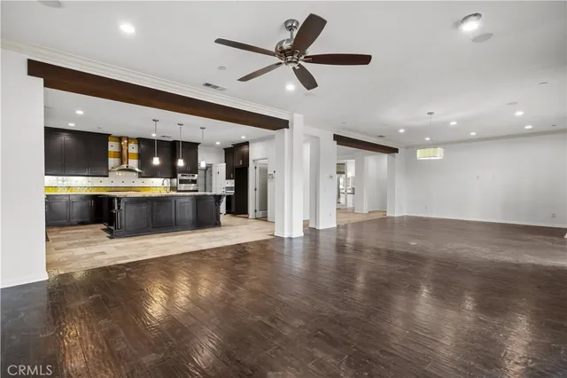 a view of a kitchen with a sink and a stove top oven