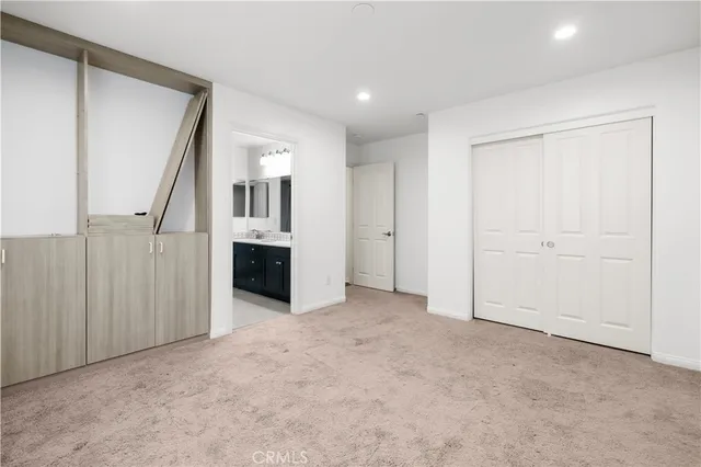 an empty room with windows and entryway