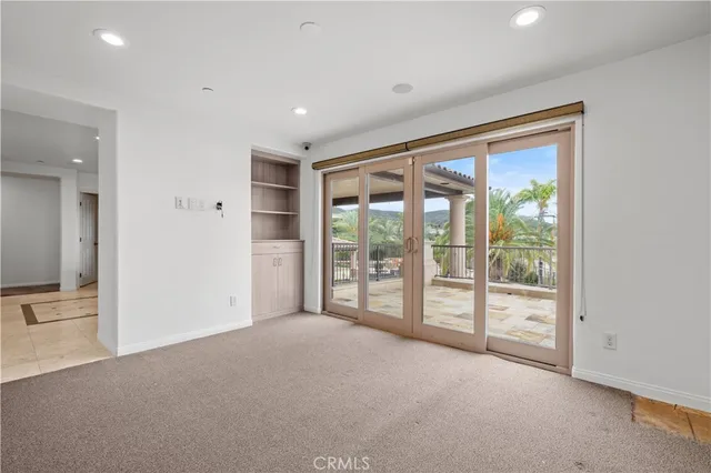 a view of an empty room with a sliding door