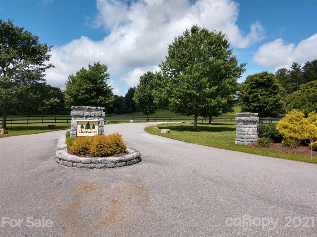 0 South Southampton Road, Unit 35 Brevard, NC 28712 - Photo 2 of 10 a front view of a house with a yard and swimming pool