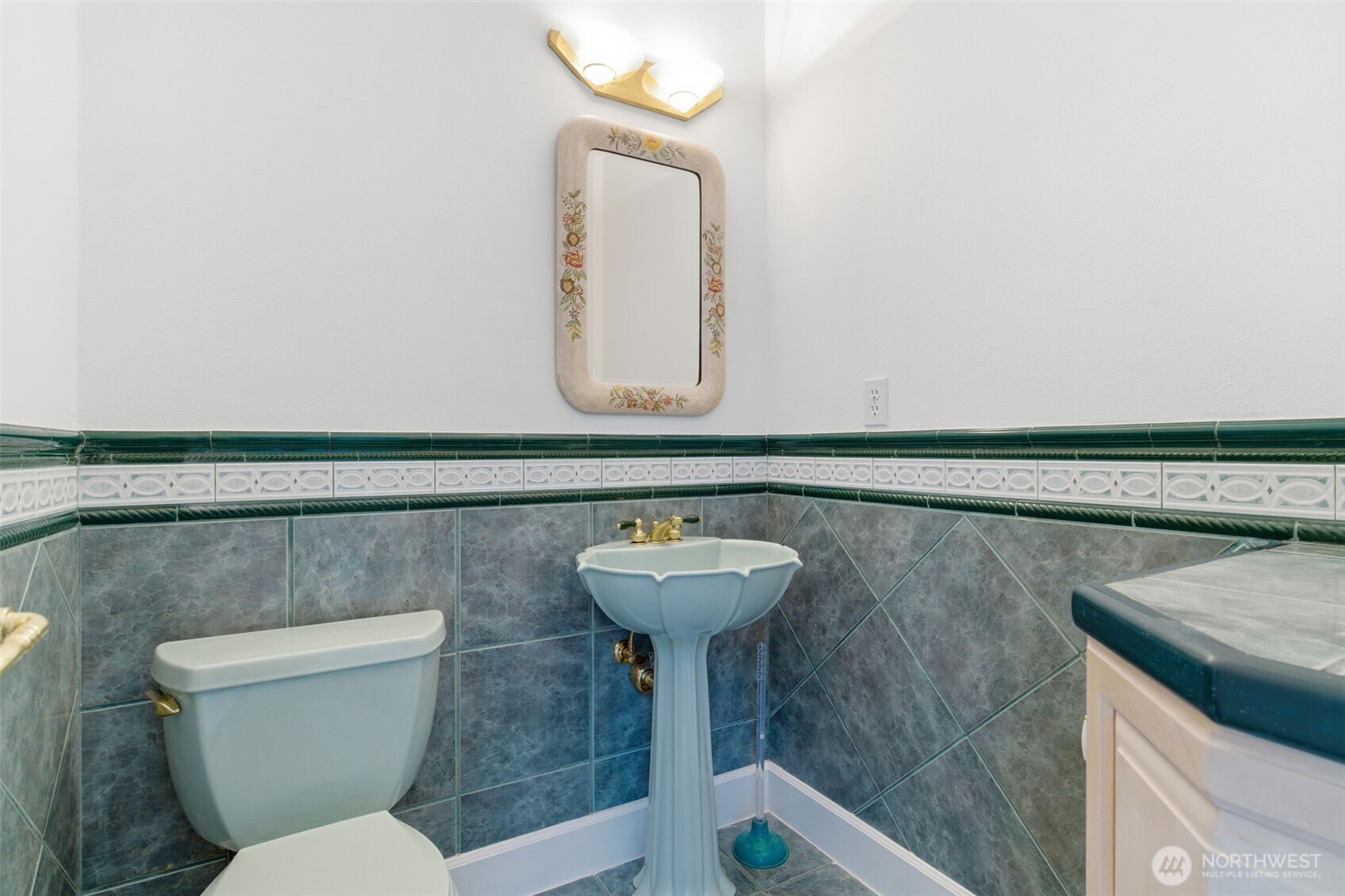 457 East Victor Road Belfair, WA 98528 - Photo 12 of 40 a bathroom with a sink mirror and toilet