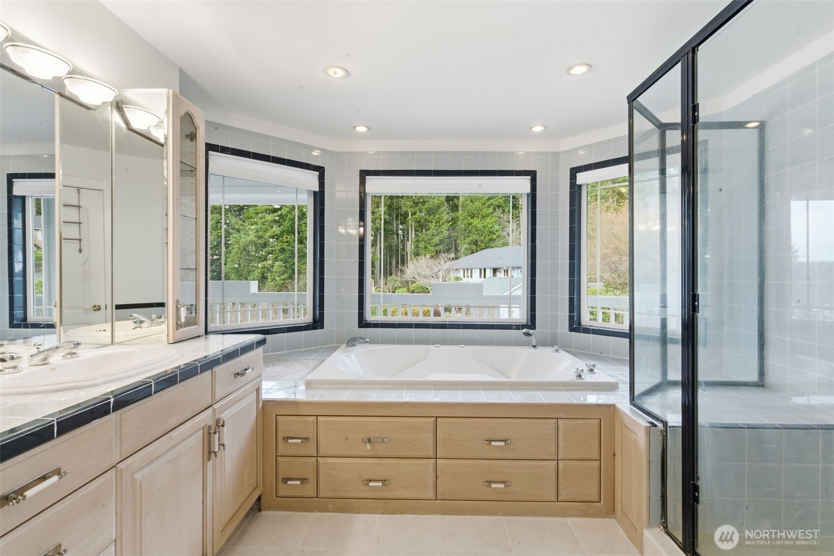 457 East Victor Road Belfair, WA 98528 - Photo 16 of 40 a bathroom with a sink and a large mirror