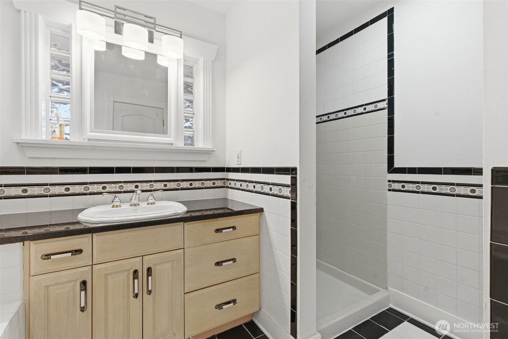 457 East Victor Road Belfair, WA 98528 - Photo 23 of 40 a bathroom with a sink and a mirror
