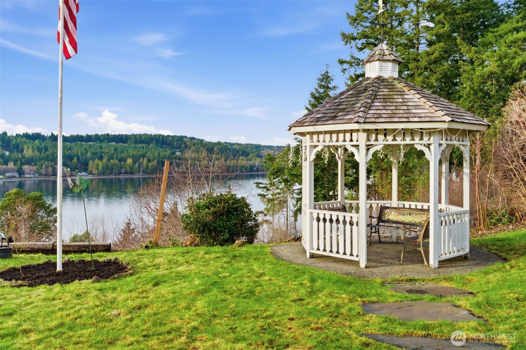 457 East Victor Road Belfair, WA 98528 - Photo 37 of 40 a view of a house with a yard from a lake view
