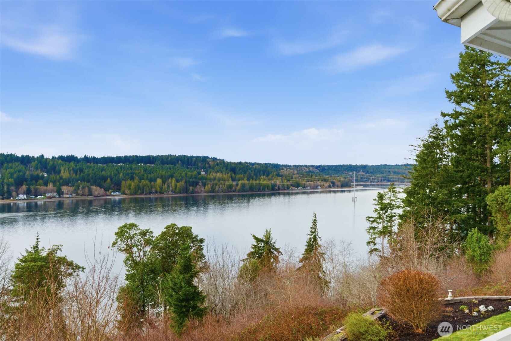 457 East Victor Road Belfair, WA 98528 - Photo 5 of 40 a view of a lake with a mountain in the background