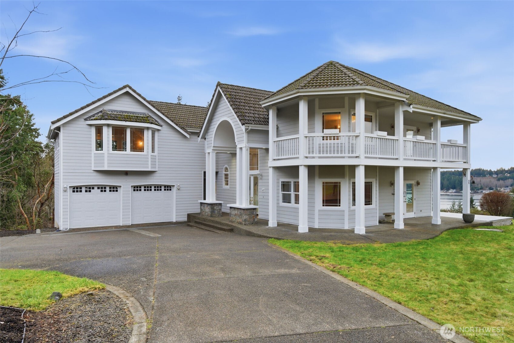 457 East Victor Road Belfair, WA 98528 - Photo 6 of 40 a front view of a house with garden