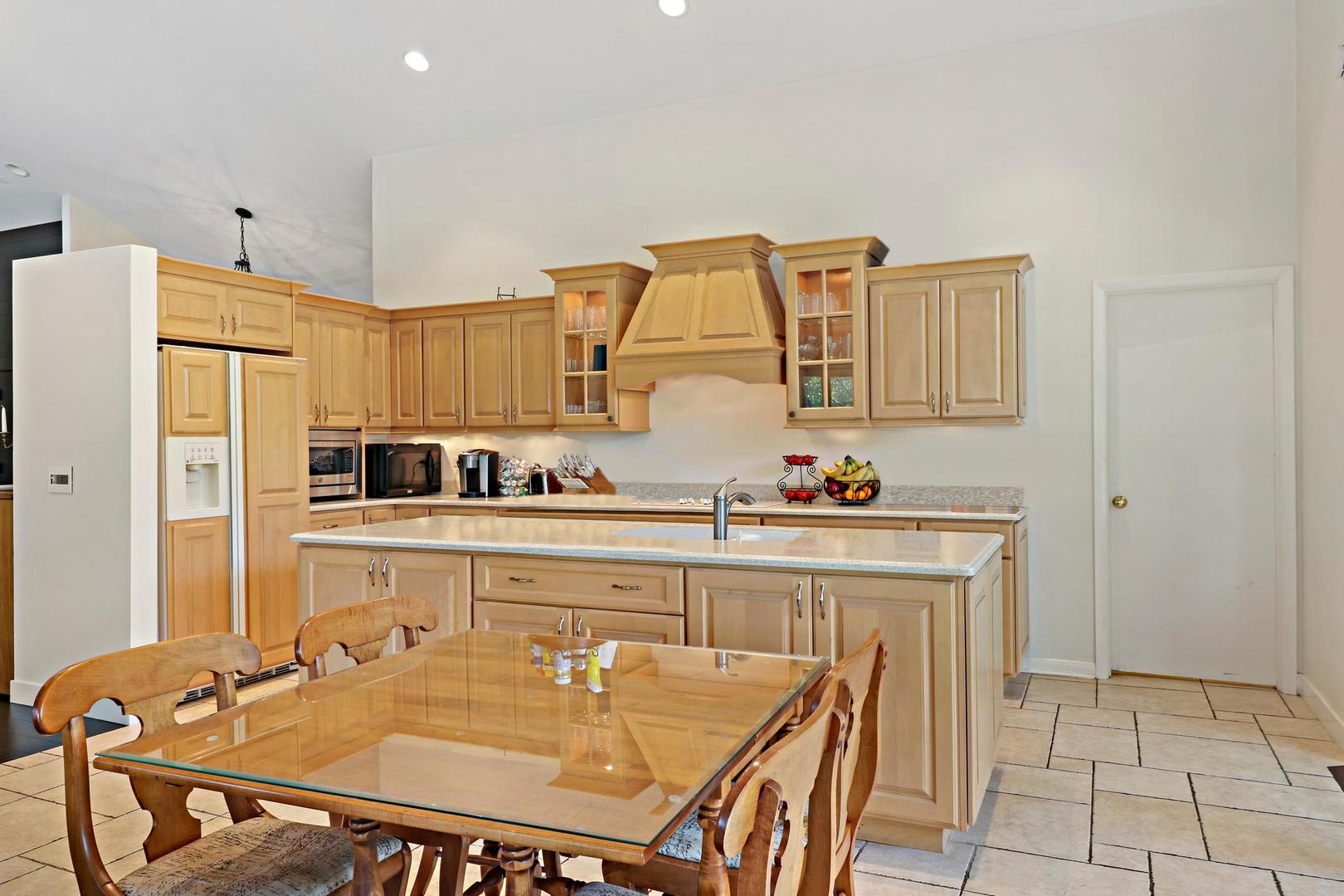 30 West Mundhank Road South Barrington, IL 60010 - Photo 22 of 45 a kitchen with stainless steel appliances granite countertop a stove a sink dishwasher and a refrigerator with wooden floor