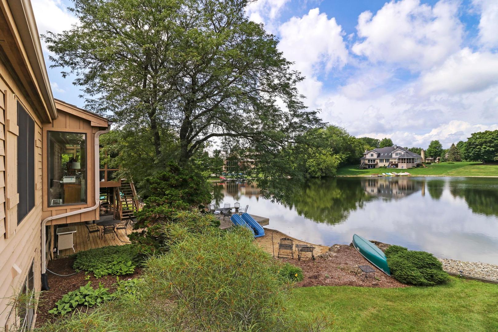 30 West Mundhank Road South Barrington, IL 60010 - Photo 29 of 45 a view of a lake with a house in the background