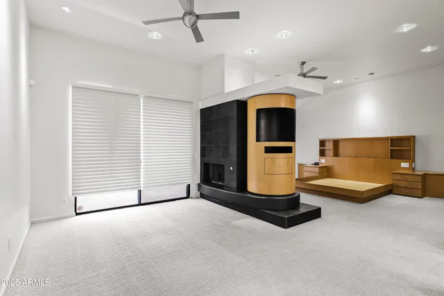 a view of an empty room with a fireplace