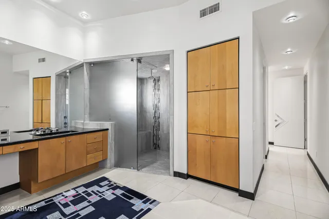 a bathroom with a bathtub a sink a mirror and a shower