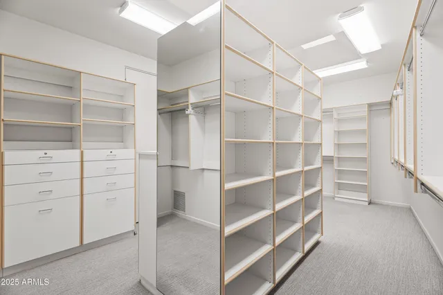 a room with a table and a fireplace