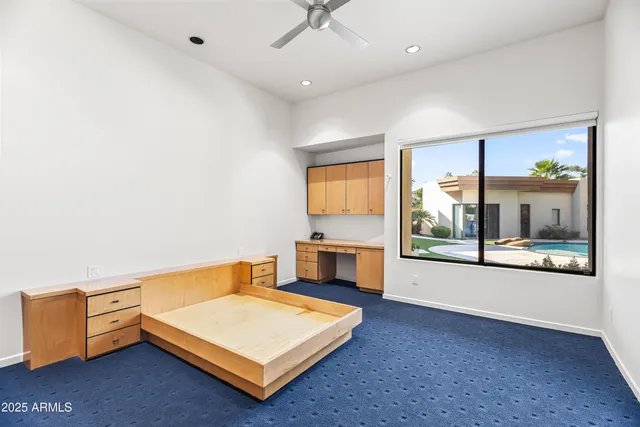 a living room with hard wood floors and a table