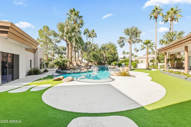 a view of a house with backyard porch and furniture