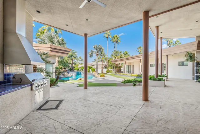 a swimming pool with outdoor seating and yard