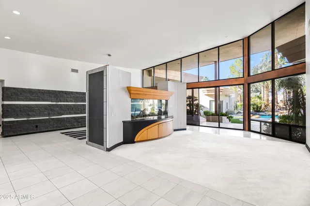 a kitchen with stainless steel appliances granite countertop a sink and a stove