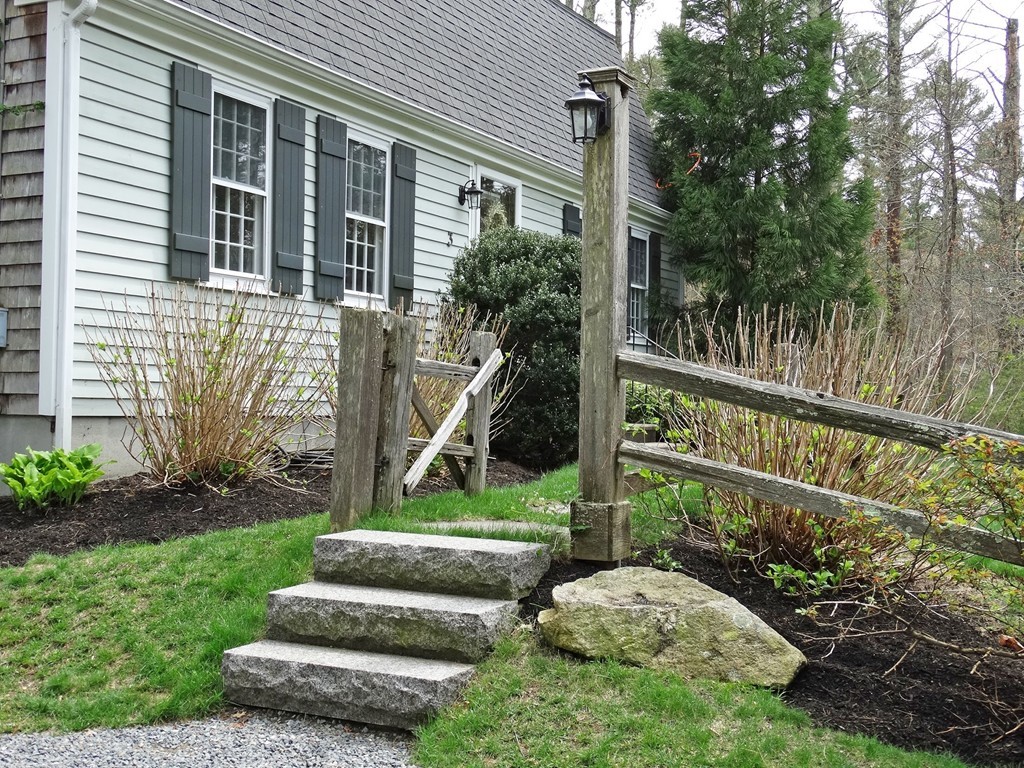 3 Bassett Street Rochester, MA 02770 - Photo 3 of 28 a view of a garden with a fountain