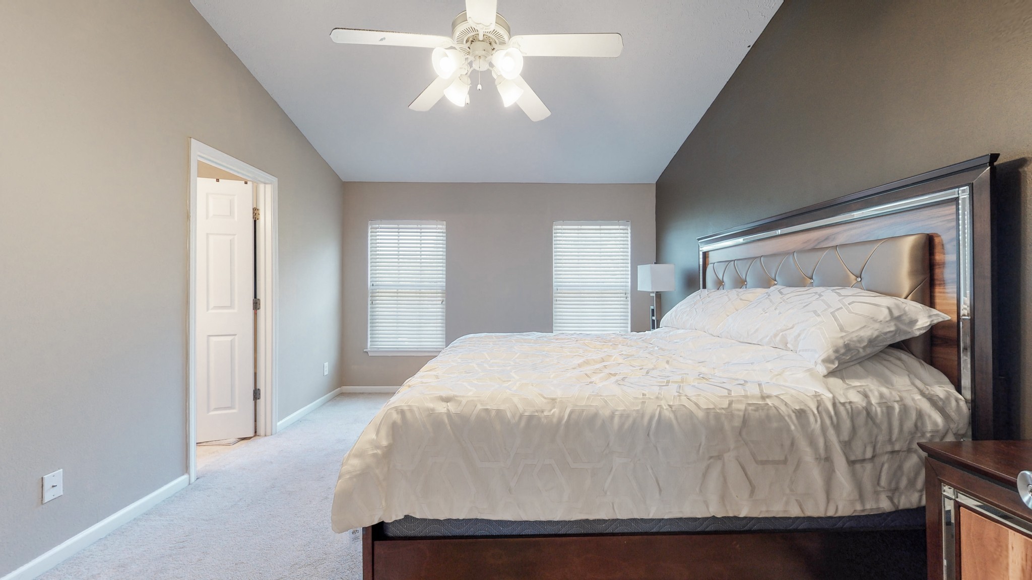 2004 Shaylin Loop Antioch, TN 37013 - Photo 11 of 25 a bedroom with a large bed and a chandelier