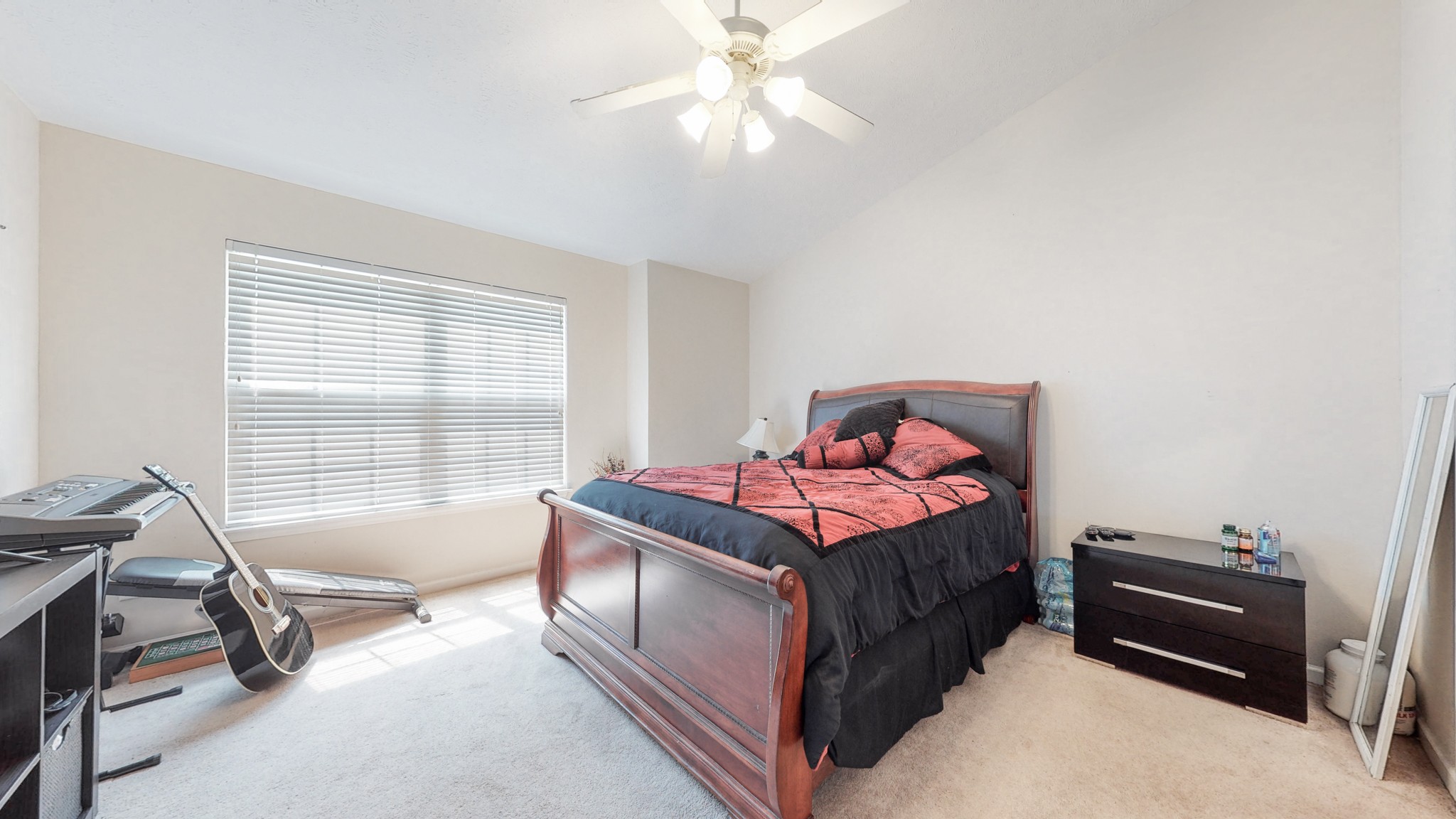 2004 Shaylin Loop Antioch, TN 37013 - Photo 13 of 25 a bedroom with a bed and a chandelier