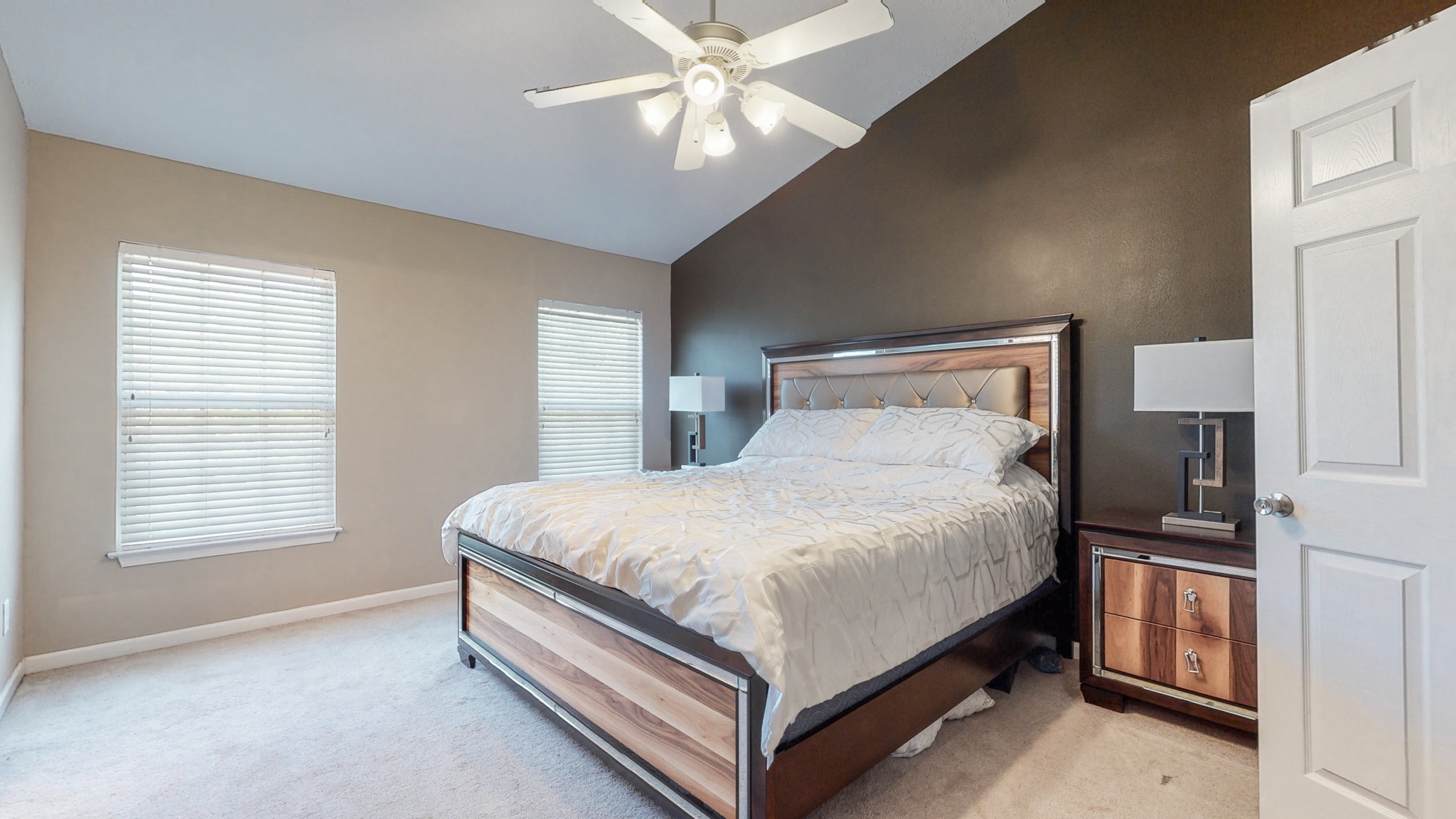 2004 Shaylin Loop Antioch, TN 37013 - Photo 10 of 25 a bed sitting in a bedroom next to a window and a chandelier
