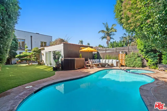 a view of a house with a yard porch and sitting area