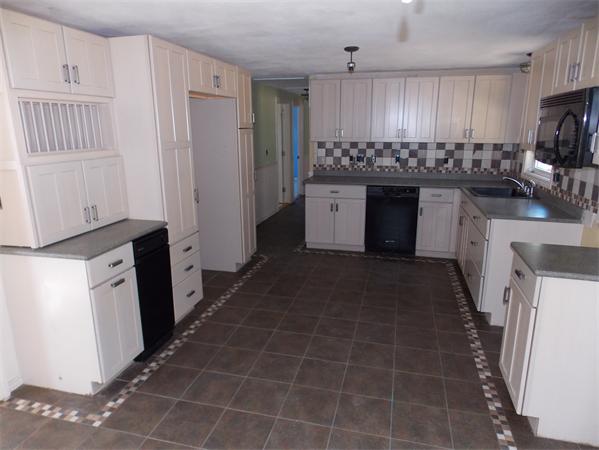 592 County Road Wareham, MA 02576 - Photo 3 of 16 a kitchen with granite countertop a stove a sink and a refrigerator